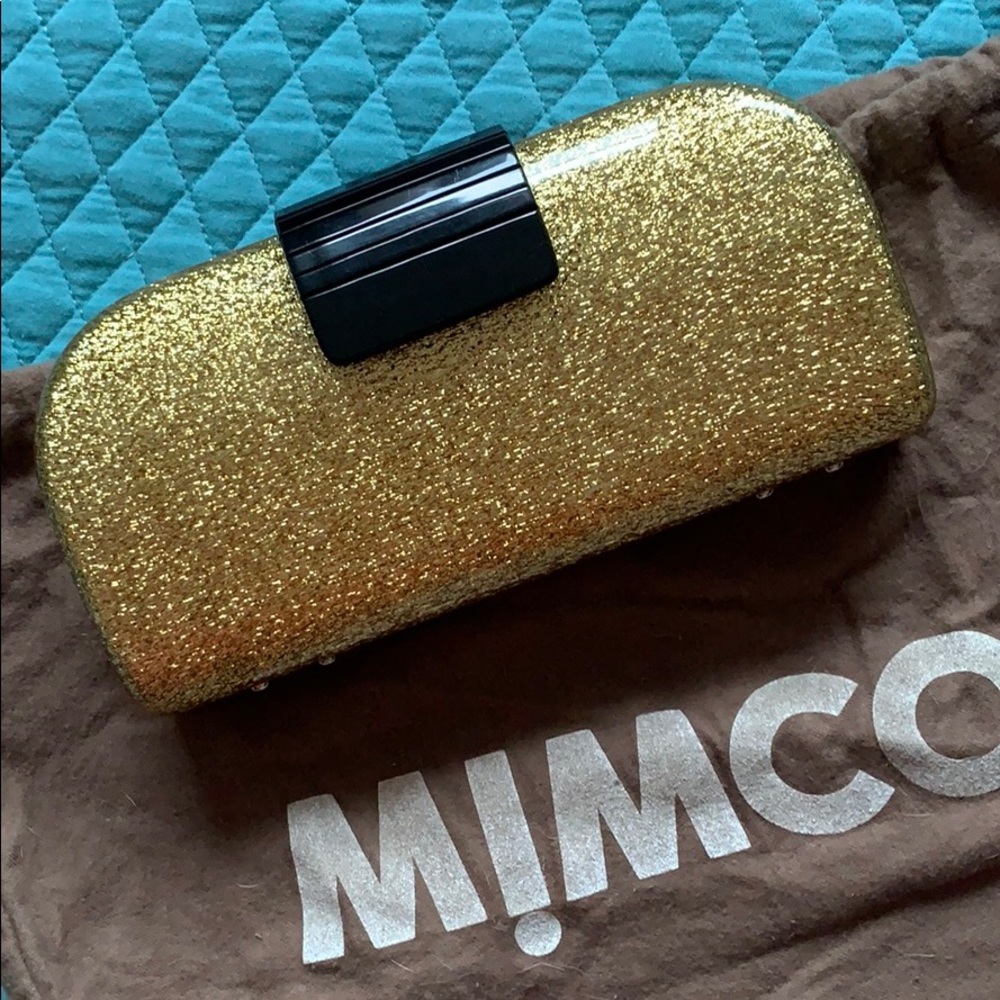 Mimco gold acrylic clutch with black buckle